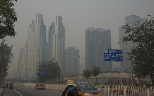 Beijing, A!hina - Oct 17,2013: Beijing CBD in Haze.Air Pollution is a big problem in Beijing now,haze often happens,brings about serious traffic and healthy issues.An aweful day again in CBD,haze became heavier and heavier.