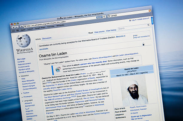 Screenshot of a Wikipedia page on Osama Bin Laden Florence, Italy - May 2, 2011: Close up of the Osama Bin Laden on wikipedia.org site . Wikipedia is a free, web-based, collaborative, multilingual encyclopedia project supported by the non-profit Wikimedia Foundation. Its 17 million articles (over 3.5 million in English) have been written collaboratively by volunteers around the world, and almost all of its articles can be edited by anyone with access to the site. The browser is Safari. wikipedia stock pictures, royalty-free photos & images