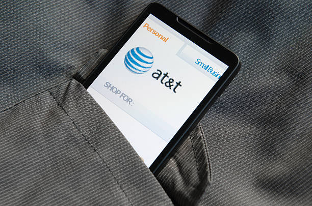 Smartphone mit im & T.com Haus in der Tasche – Foto