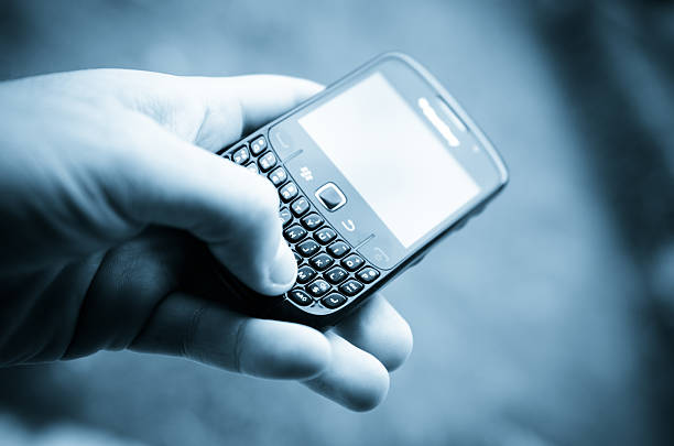 Florence, Italy - March 11, 2011: Hand holding a Blackberry smartphone with mobile version of www.facebook.com site. Facebook is a social networking website, owned by Facebook, Inc., for free access. It is the second most visited site in the world, preceded only by Google. The smartphone is a Blackberry Curve 8520. BlackBerry is a trading name of a series of portable smartphone produced by Canadian company Research In Motion (RIM).