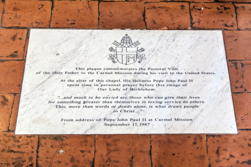 Carmel, USA - July 27, 2008: plaque at altar with Mary at Carmel Mission San Carlos Borromeo in Carmel, USA. Pope Paul II was worshiping the holy maria at Carmel.