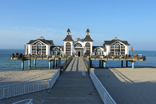 Sellin, Germany - May, 20th 2010 ; Seabridge with Restaurant, Tourists, People on Holidays, eating and drinking outdoor and indoor