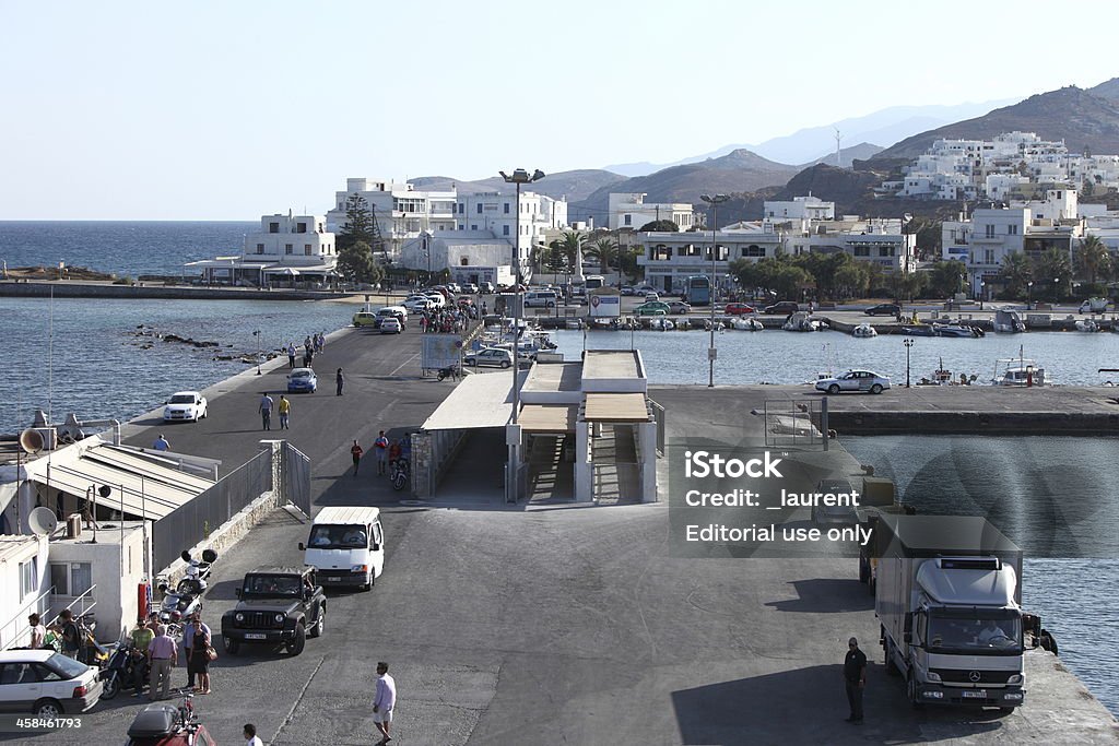 Naxos harbor, Greece Naxos, Greece - September 10, 2013: Pier for the ferry to the port of Naxos, Greece. Passengers await the arrival of the ferry to boarding. Boarding Stock Photo