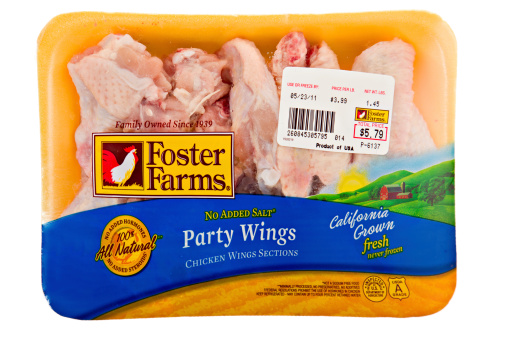 Chico, California, USA - May 16, 2011 : An overhead close up view of a 1.45 LB package of Foster Farms California grown fresh party wings. Foster Farms had it\\'s beginnings in 1939 near Modesto California.