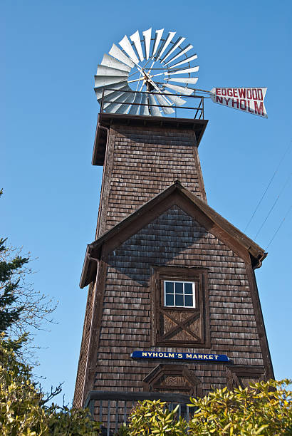 Historic Edgewood Nyholm Windmill Edgewood, Washington, USA - April 23, 2011: The historic Nyholm Market and Windmill, built in 1902, greets visitors to the town. jeff goulden puyallup washington stock pictures, royalty-free photos & images