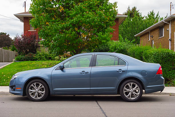 Ford Fusion Hamilton, A!anada - September 22, 2013: Blueish gray colored, 2012 model Ford Fusion mid-size sedan parked on the street. 2010 stock pictures, royalty-free photos & images