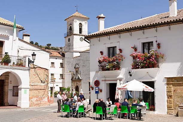 Grazalema, Andalucia, Spain Grazalema, Cadiz, Spain - April, 17th 2011; People drinking and talking at the terrasse from a bar of the village of Grazalema an beautifull day of spring, typical scene from the andalusian villages. grazalema stock pictures, royalty-free photos & images