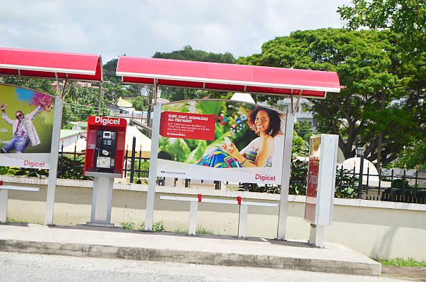 Castries, St Lucia - October 02, 2013: Digicel, telecommunications service provider, visual marketing and telephone booth on bus shelter near Serenity Park Castries.