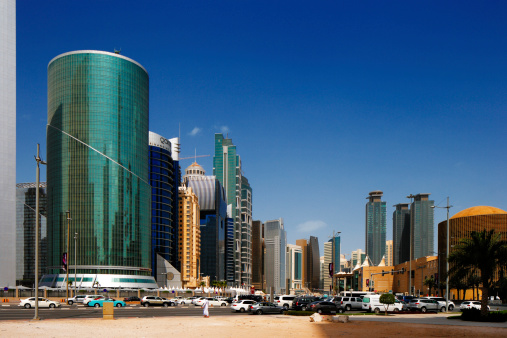 Doha, Qatar - May 2, 2013: Tall buildings of the West Bay area. The West Bay is rapidly expanding urban center of Doha with numerous skyscrapers gracing the skyline of the city