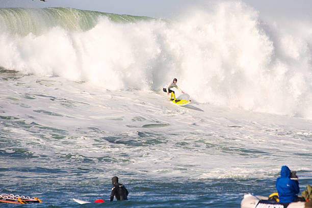 Maverick Invitational Surfing contest Half Moon Bay, California, USA aa January 20, 2013: Competitor surfing on a classic wave during the Maverick Invitational Surfing event in Half Moon Bay California. mavericks california stock pictures, royalty-free photos & images