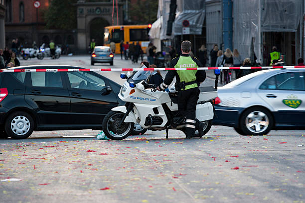 Motorcycle cop controlling traffic stock photo