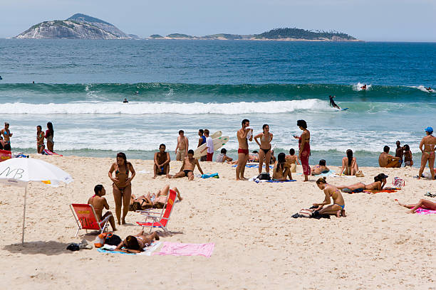 Leblon beach full of tourists and local people.