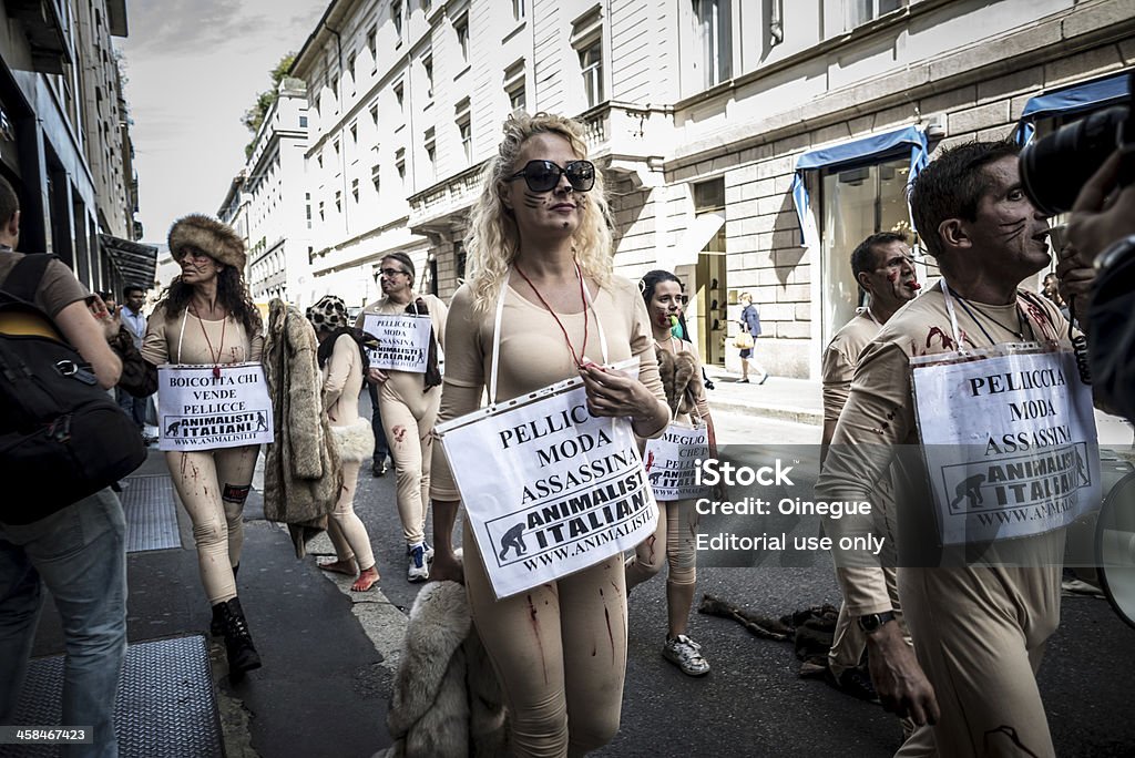 Animalisti Italiani protest against Milan Fashion Week on Septem Milan, Italy - September 17, 2013: Animalisti Italiani protest against Milan Fashion Week on September 17, 2013. Animal right association 'Animalisti Italiani' protest against furs and fashion, in famous fashion Milan street Monte Napoleone 2013 Stock Photo