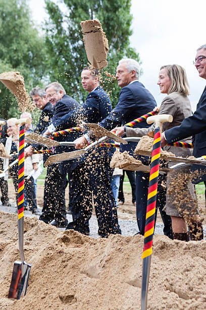 Wiesbaden, Germany - September 11, 2013: Florian Rentsch (FDP), Hessian minister for Economics, Transport and Regional Development, Peter Ramsauer (CSU), German Federal Minister of Transport, Building and Urban Development, Kristina Schroeder (CDU), German Federal Minister of Family Affairs, Senior Citizens, Women and Youth and Roger Lewentz (SPD), Rhineland-Palatinate minister for the Interior and infrastructure during the groundbreaking ceremony for expansion and new construction of German Autobahn A 643 between Wiesbaden and Mainz. The completion of building operations for the new bridge and highway is scheduled for 2019.