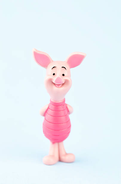 Piglet from Winnie the Pooh Suffolk, Virginia, USA - April 30, 2011: A vertical studio shot of the fictional character Piglet, who was originally created by the author A.A. Milne in the Winnie the Pooh Series of books. Here Piglet is standing looking at the camera with his hands behind his back and is smiling. winnie the pooh photos stock pictures, royalty-free photos & images