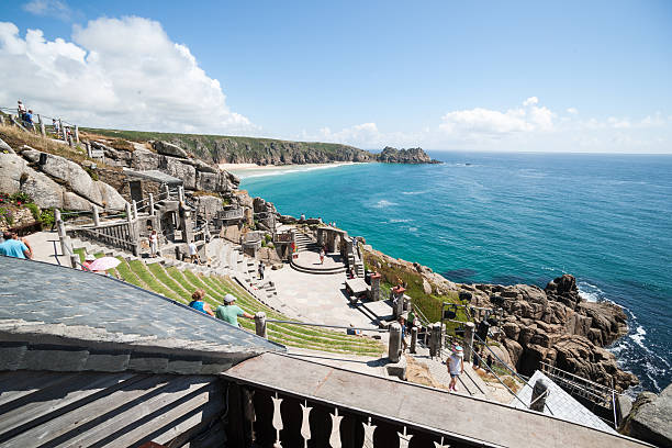 Minack Theater, Cornwall. Porthcurno, Cornwall, England - July 25, 2013: Minack Theater, Cornwall. Coastal open-air amphitheater constructed on coastal cliffs in Cornwall and known as Minack Theater. baluster stock pictures, royalty-free photos & images