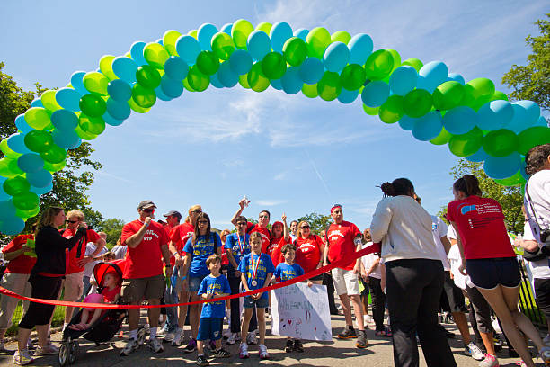 Liver Life Walk New York City, NY, USA - June 3, 2012: Participants gather for annual Liver Life Walk from Battery Park in New York City on June 3, 2012. American Liver Foundation hosts this 3 mile walk to raise money each year. walking for a cause stock pictures, royalty-free photos & images