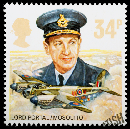 Exeter, United Kingdom - October 24, 2011: A British Used Postage Stamp celebrating the History of the Royal Air Force, showing a Lord Portal and a Mosquito Bomber Plane, printed and issued in 1986
