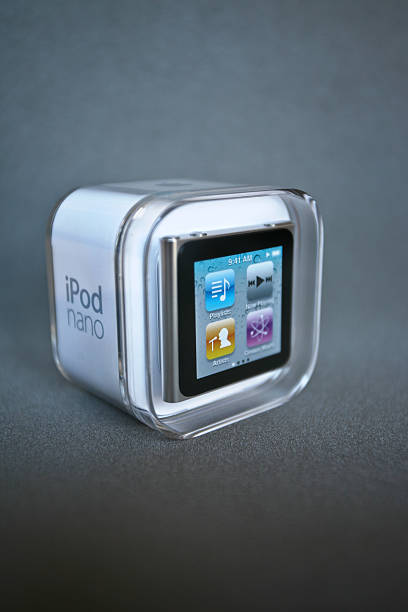 The new iPod Nano in original box Dublin, Ireland - May 22, 2011: The new iPod Nano 6th generation with multi-touch screen in silver finish. View iPod Nano in original box. Image taken on a color mating background. Front/left-side view. ipod nano stock pictures, royalty-free photos & images