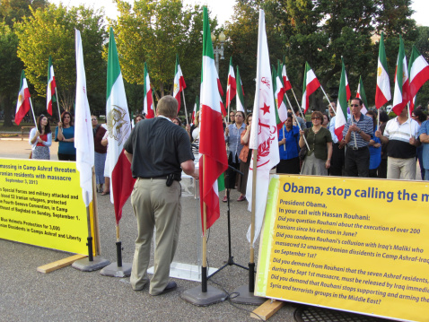 Washington DC, USA-October 5, 2013:  These Iranian people bear Iranian flags at the White House in Washington DC to protest against Iraq and the kidnapping of hostages and killing of  Iranian refugees at Camp Ashraf in Iraq by Iraqi Maliki forces.  This is an ongoing problem and these people also accuse Iranian president Rouhani of collusion with Maliki forces.