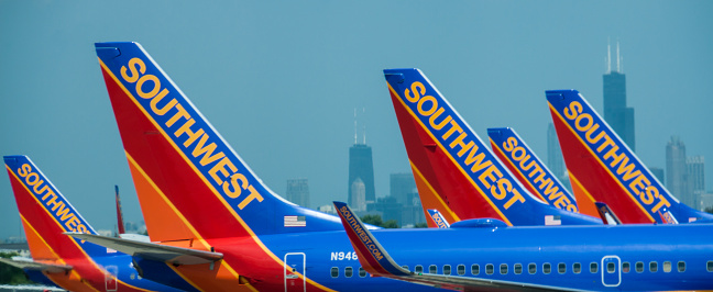 Chicago, Illinois, USA - May 21, 2013:  Southwest Airlines aircraft on the move with the Chicago skyline in the background.