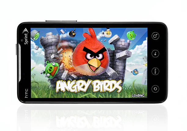 HTC Evo with Angry Birds Indianapolis, Indiana, USA - April 29, 2011: An HTC Evo is displayed against a white background with the popular Angry Birds game on the screen. sprint nextel stock pictures, royalty-free photos & images