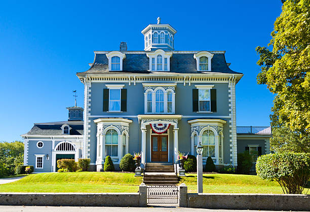 Kennebunk, ME, USA - September 19, 2013: HDR image (photorealistic) of Historic House in New England, backlit by autumn morning sun. Wide angle lens.