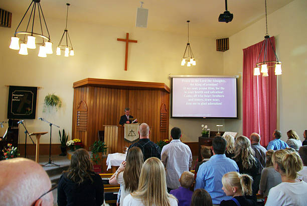 Christian Reformed Church Sunday service Athens, Canada - September 22, 2013 : Christian Reformed Church having a Sunday service for the beginning of the new season. As you can see the church is full of people and the children sitting in front. protestantism stock pictures, royalty-free photos & images