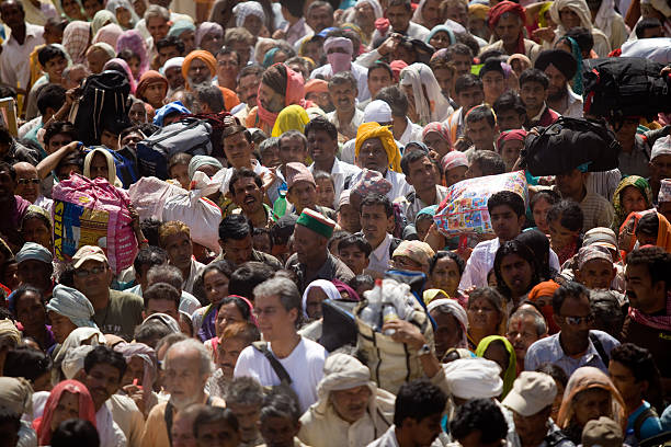 Haridwar,India - April 13,2010:India is the second most populous country in the world.Stats of April 2010  is about 1.18 billion people. This is more than a sixth of the world's population i.e. 17.31% of the world's population, By 2025 India  is projected to surpass China and will be the world's most populous country.During festivals the tension of the crowd is seen more and more.Pilgrims in congestion tries to pass the bridge in Haridwar during Kumbh Mela.