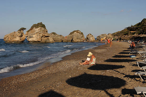 People Relaxing on a Greek Beach stock photo
