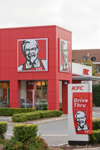Adelaide, Australia - May 9, 2011: A KFC (Kentucky Fried Chicken) suburban store in Australia. Includes the famous Colonel Sanders trademark and drive through signs.