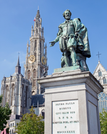 Antwerpm Belgium - Septembner 4, 2013: Statue of painter P. P. Rubens and tower of cathedral by Willem Geefs (1805-1883)