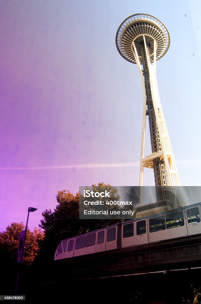 Seattle Monorail Seattle, USA - September 19, 2013: The Seattle Monorail and Space Needle reflected on the the Experience Music Project wall on a sunny day. The Monorail was originally built in 1962 for the Worlds Fair. Abstract Stock Photo