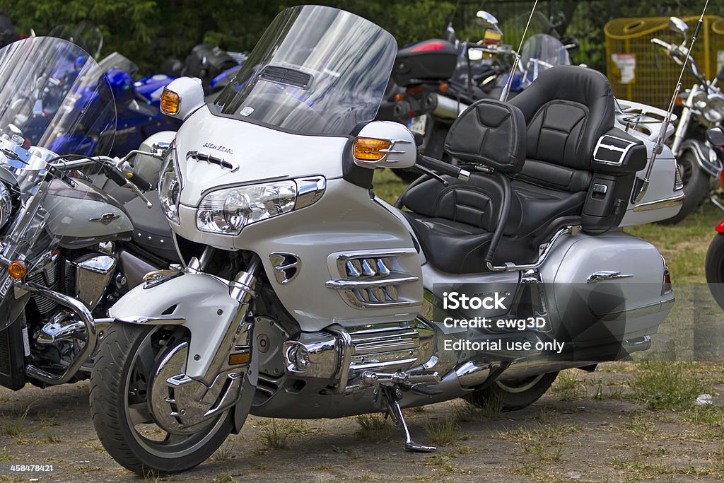 Silver Honda Goldwing Szczecin, Poland - May 28, 2011: Silver Honda Goldwing in motorcycle parking lot in the Park. The Honda Goldwing is a touring motorcycle designed and manufactured by Honda. It was introduced October 1974, and went on to become a popular model in North America, Western Europe and Australia. Brand Name Stock Photo