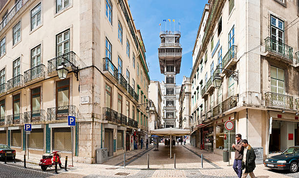 Lisbon Elevador de Santa Justa Baixa landmark panorama Portugal Lisbon, Portugal - March 27th, 2011: Locals walking through the downtown shopping streets under the iconic gothic iron tower of the Santa Justa Lift in the Baxia district. santa justa lift portugal stock pictures, royalty-free photos & images
