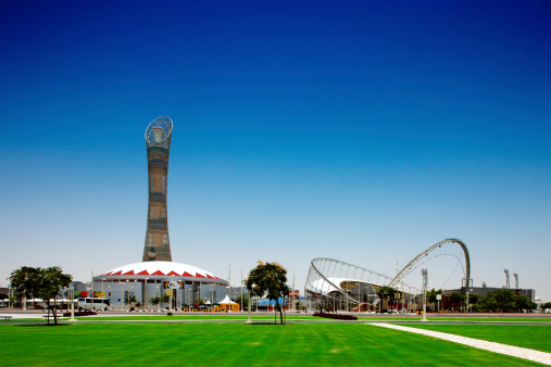 Doha, Qatar - May 19, 2010: The Khalifa International Stadium and 300 m tall Aspire Tower. The Stadium will play a central role in the 2022 Fifa football World Cup
