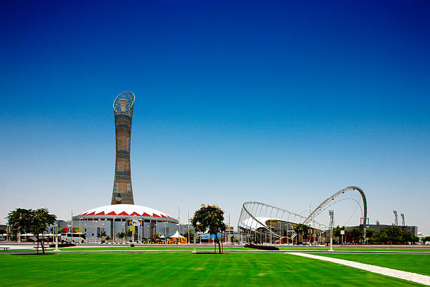 The Khalifa International Stadium and 300 m tall Aspire Tower Doha, Qatar - May 19, 2010: The Khalifa International Stadium and 300 m tall Aspire Tower. The Stadium will play a central role in the 2022 Fifa football World Cup khalifa stock pictures, royalty-free photos & images