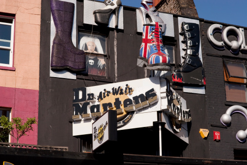 London, United Kingdom - April 26, 2011: Dr Martens, shoe retailer, store front in Camden Town, London, UK. The is a logo and trendy boots attached to the building's facade.