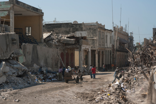 Port-au-Prince, Haiti, February 09, 2010: An earthquake destroyed the center of Port-au-Prince nearly completely. People are looking in the ruins after some useful stuff.