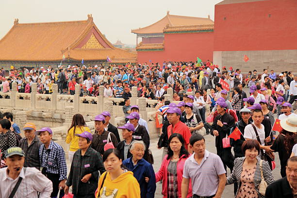 Beijing, China - July 18 2010 : the sky is polluted with smog abobe the main landmark the forbidden city while these people are looking at it