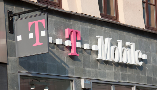 Glasgow, Scotland, UK - 19th April, 2011: Sign and logo above a branch of T-Mobile, a German based telecommunications provider owned by Deutsche Telekom, T-Mobile operates in certain European countries and in the US.