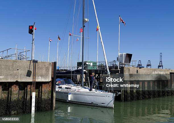 Dinghy Exiting The Lock At Shotley Marina Stock Photo - Download Image Now - Activity, Adult, British Culture