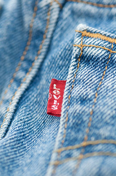 Close Up Levis Tag On Old Pair Of Blue Jeans Stock Photo - Download Image  Now - Levi's, Jeans, Label - iStock