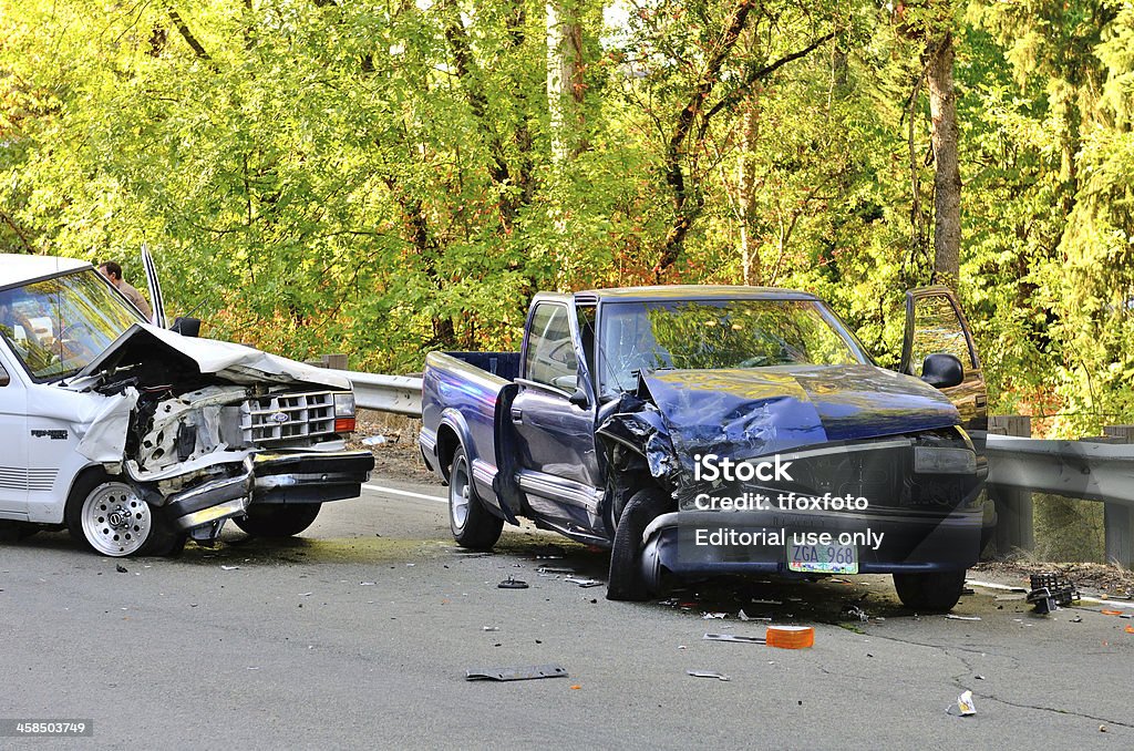 Two Truck Wreck Roseburg, OR, USA - August 29, 2013: Two vehicle head-on accident, caused by one truck failure to yield,  results in no injuries at a rural intersection in Roseburg, OR on August 29, 2013 Crash Stock Photo