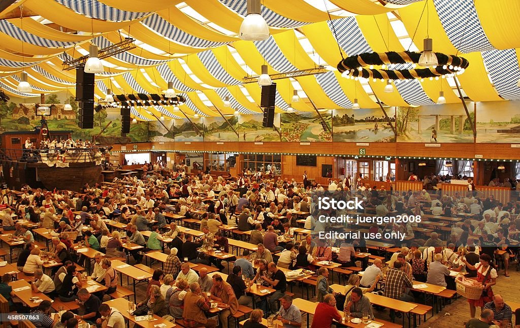 Octoberfest in Munich Munich, Germany - September 22, 2010: People are sitting in the beer tent at the Octoberfest in Munich 2010 Stock Photo