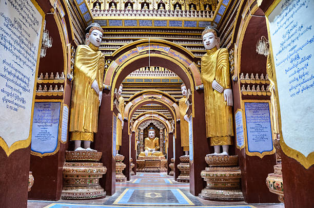 Mandalay, Myanmar - September 13, 2012: Buddha statues in Buddhist monastery near Mandalay, Myanmar.
