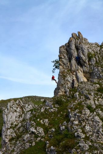 Herbrechtingen, Germany - September 22, 2013: Climbers on a rock in action in the Swabian Alb valley \
