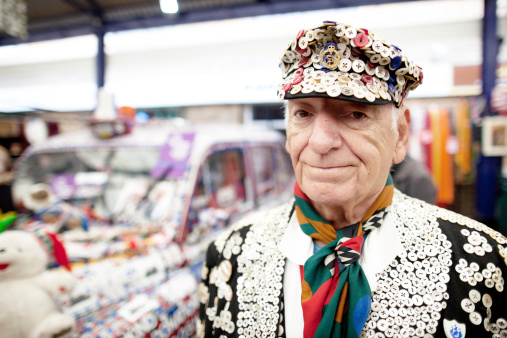London, United Kingdom -  April 29, 2011:Pearly King portrait. The Cockney culture refers to working people from the East end London. Theirs tradition of wearing clothes decorated with pearl buttons originated in the 19th century. Henry Croft was the first one who started this practice to get more attention while collecting money for charity.