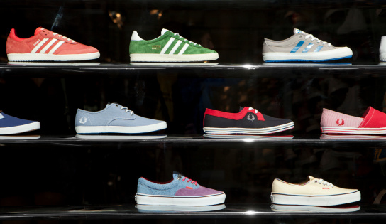 London, UK - May 3, 2011: A range of fashion trainers of various brands on display in a Carnaby Street, London, shop window.