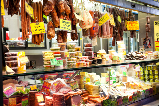 Melbourne, Australia - April 8, 2011: Shop front displaying various deli meats, olives and condiments at the Queen Victoria Markets, a famous landmark in Melbourne, Australia